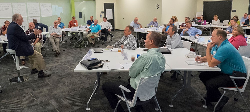 Attendees listen to a speaker at a Goering Center event