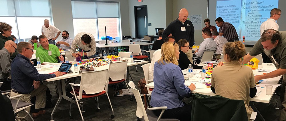 Attendees work in groups at a Goering Center Institutes session