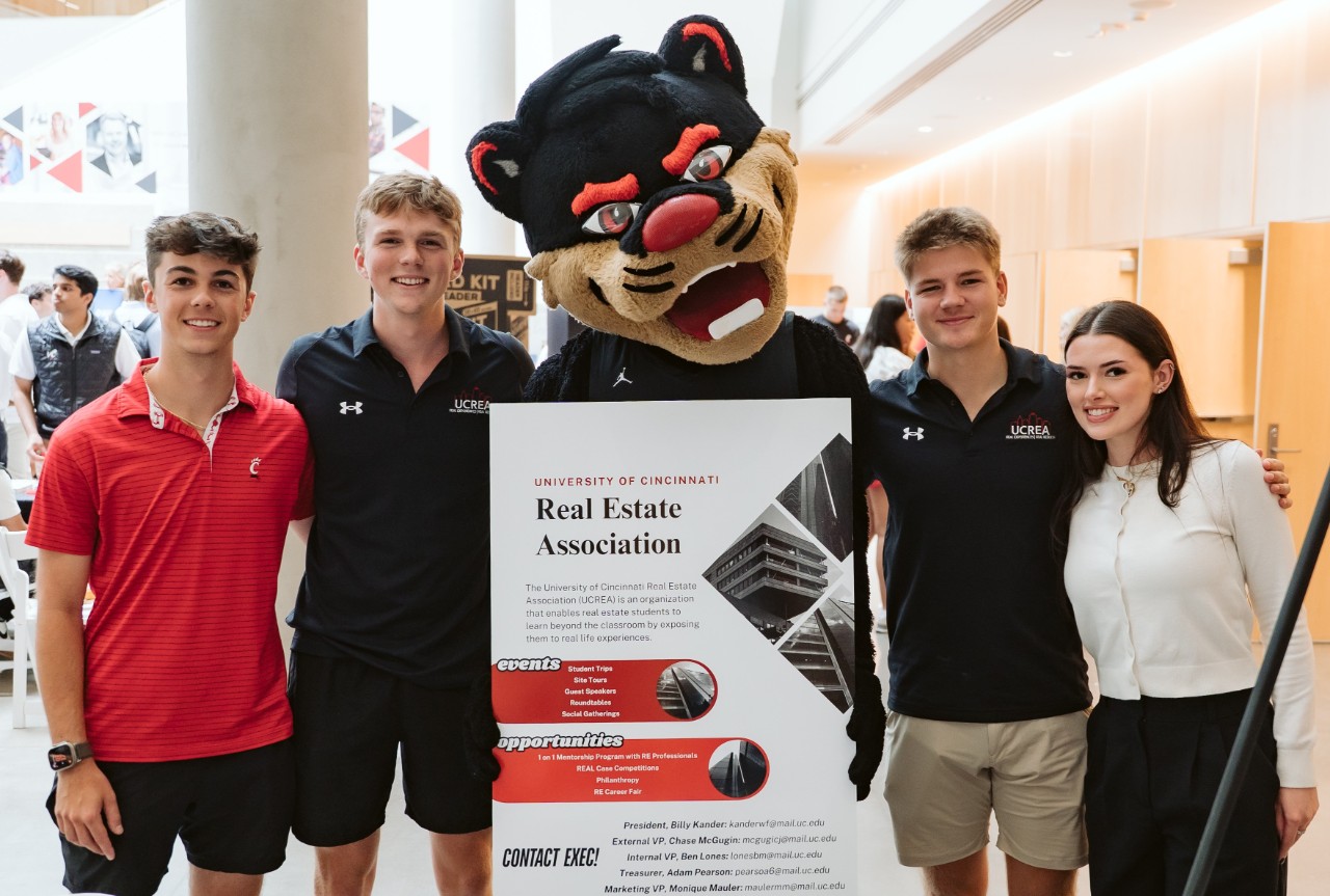 UC Real Estate Students Ben Lones, Billy Kander, Carter Eilers, and Moniique pose with the Bearcat