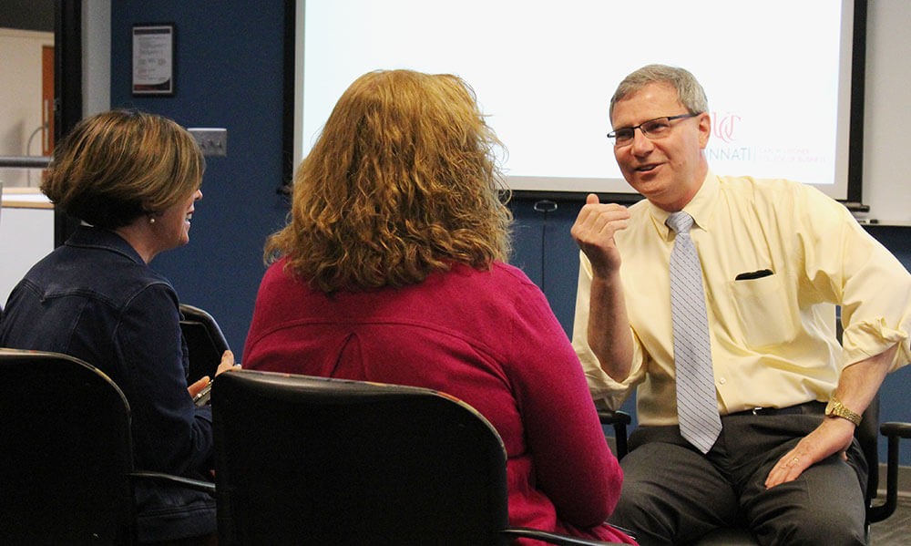 Nick Williams, right, speaks with Roseann Hassey (left) and Karen Machleit (center)