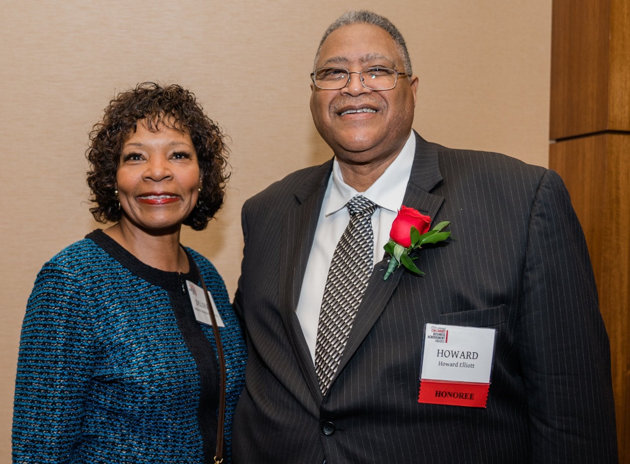 Two executive cabinet members in professional dress.