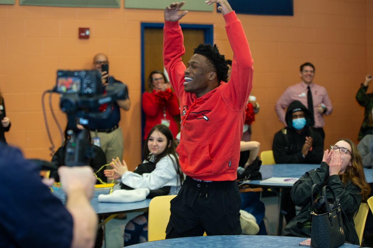 UC surprises Marian Spencer Scholar Zamir Frazier at Riverview East Academy on Decision Day.